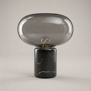 Bramley cordless table lamp with smoked glass shade and black marble-style base
