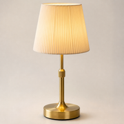 Gold Cavendish cordless table lamp with cream pleated shade and brushed brass base