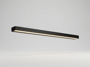 Black linear outdoor wall light glowing on a clean studio background