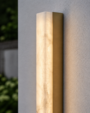 Close-up of the Eaton translucent stone veining and brushed gold side frame
