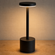 Black Fenton cordless table lamp with flat disc shade, slim stem and cylindrical base
