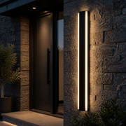 Hackney 80 cm linear outdoor wall light illuminating a modern stone entrance
