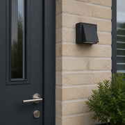 Hampstead Compact outdoor wall light shown at scale beside a UK front door
