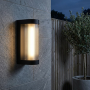 Farringdon Large Rectangular Outdoor Wall Light - Black, installed on garden wall