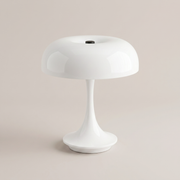 White cordless table lamp on a clean studio background