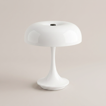 White cordless table lamp on a clean studio background