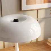 Close-up of the white cordless table lamp base and switch detail