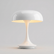 White cordless table lamp switched on with a soft warm glow