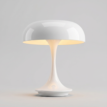 White cordless table lamp switched on with a soft warm glow