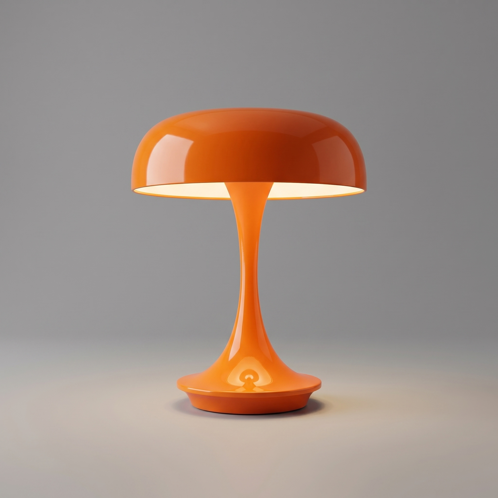 Orange cordless table lamp switched on with a soft warm glow