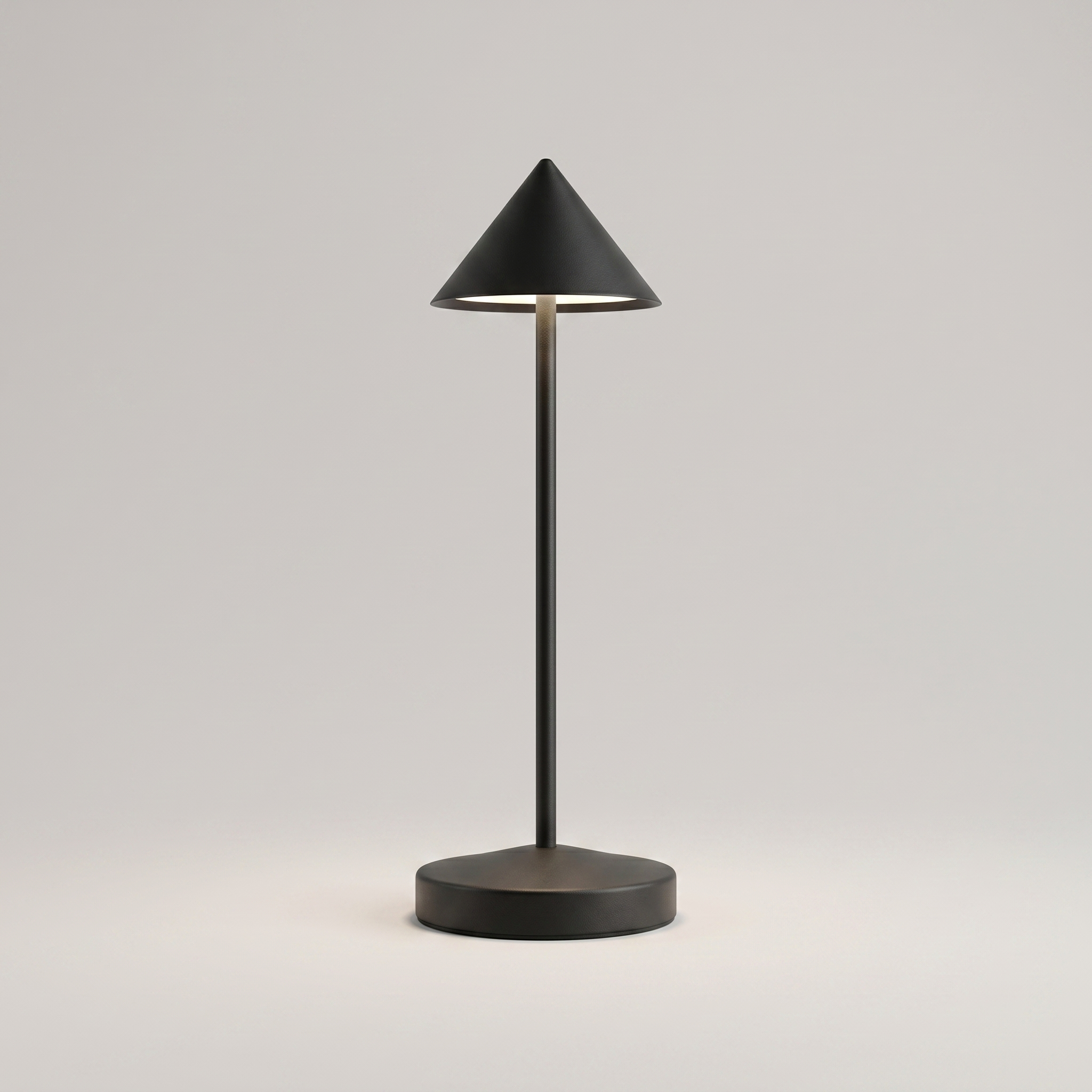 Black cordless table lamp on a clean studio background