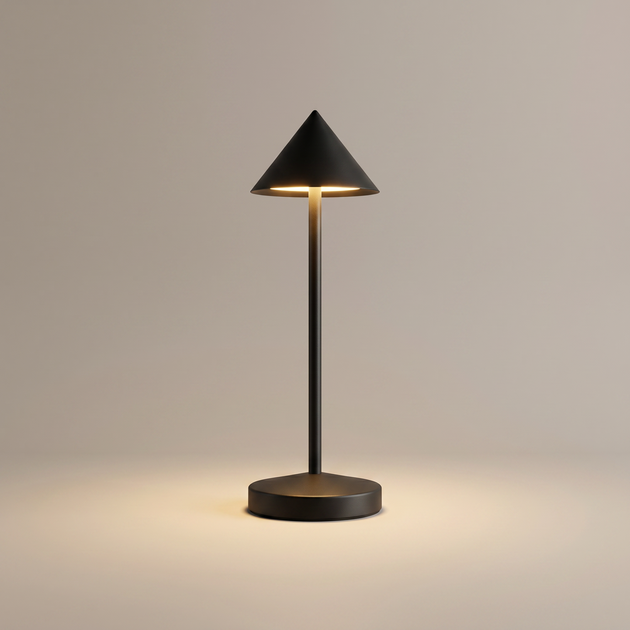 Black cordless table lamp switched on with a soft warm glow