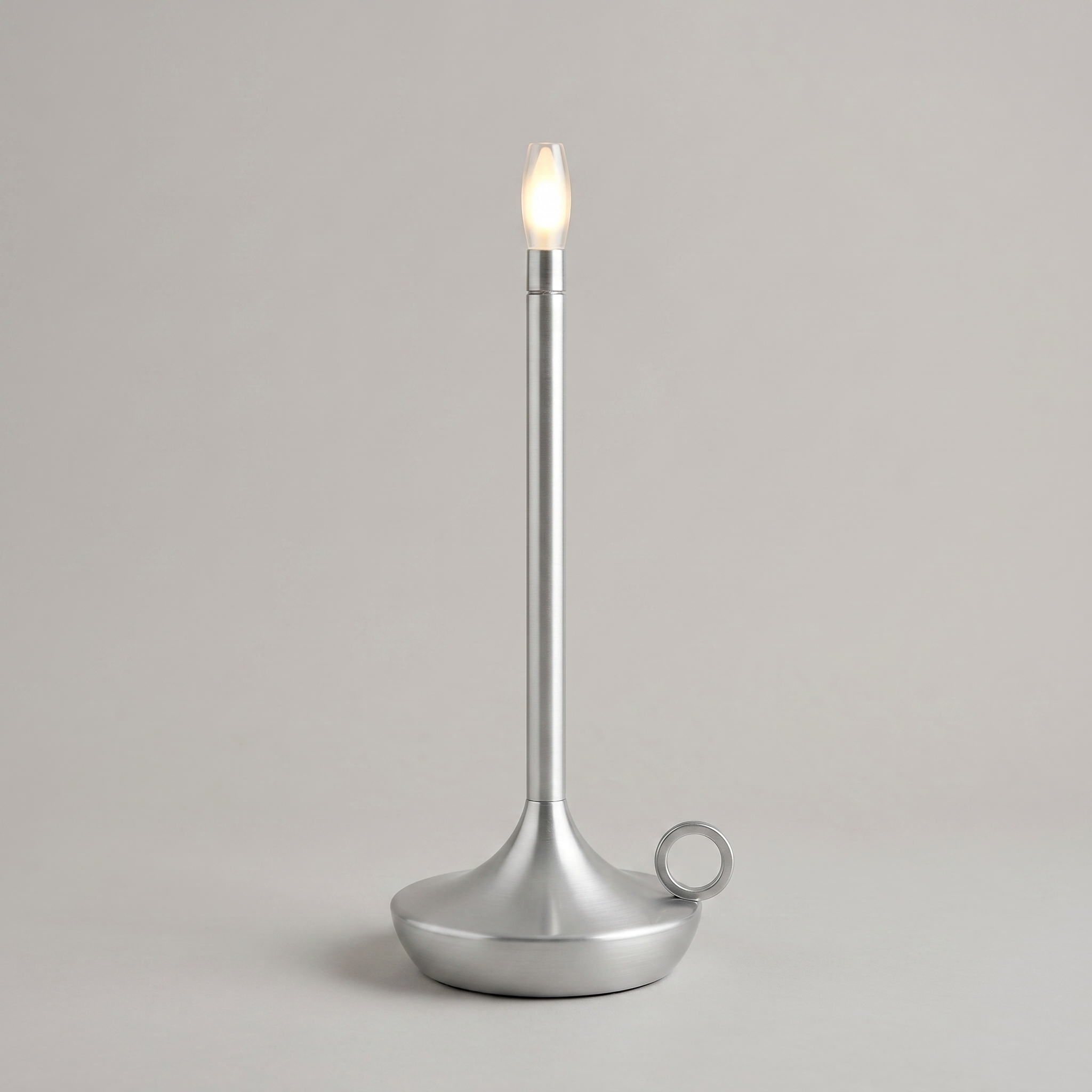 Silver cordless table lamp on a clean studio background