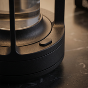 Close-up of the black metal cordless table lamp finish and texture