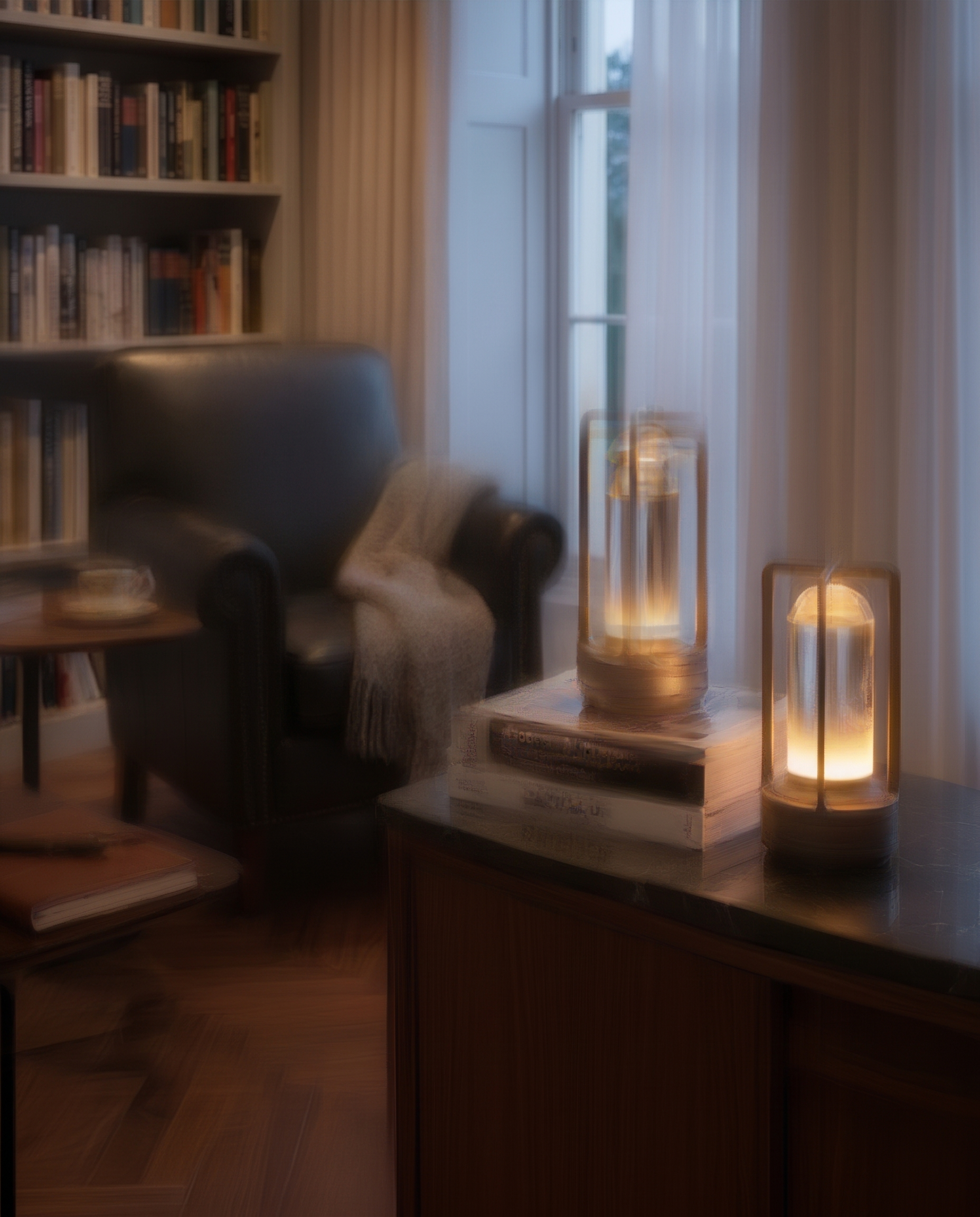 Black cordless table lamp glowing in a reading corner