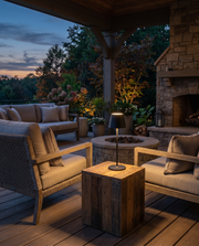 Cordless table lamp glowing on a table in a covered outdoor seating area