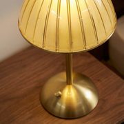 Close-up of cordless table lamp base and shade detail