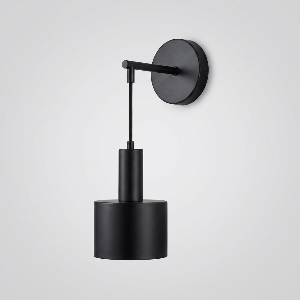 Black wall light with round backplate and cylindrical shade on plain background