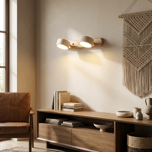 Travertine duo wall light glowing above a living room console table