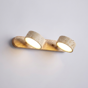 Travertine stone duo wall light on plain background
