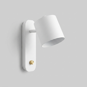 White rotatable cone wall light on plain background