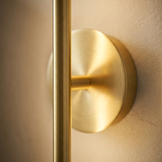 Close-up of brushed gold finish on linear wall light