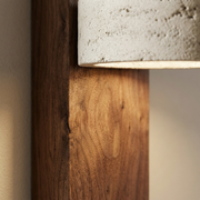 Close-up of walnut wood grain and white fabric shade