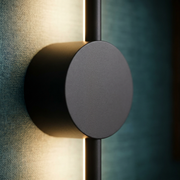 Close-up of dark linear wall light finish and mount