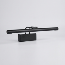 Matte black picture-style wall light on plain background
