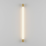 Gold vertical linear wall light on plain background