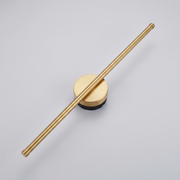 Gold vertical linear wall light on plain background
