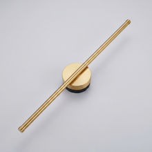 Gold vertical linear wall light on plain background