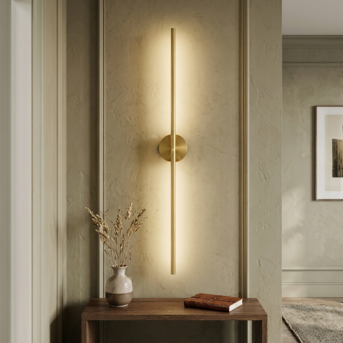 Battery wall light glowing above a hallway console table