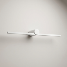 White battery wall light on a clean studio background
