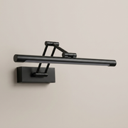 Black battery wall light on a clean studio background