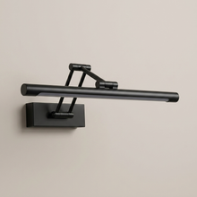 Black battery wall light on a clean studio background
