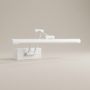 White battery wall light on a clean studio background
