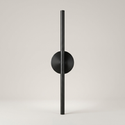 Black battery wall light on a clean studio background