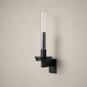Black battery wall light on a clean studio background