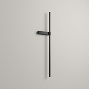Black battery wall light on a clean studio background