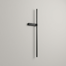 Black battery wall light on a clean studio background