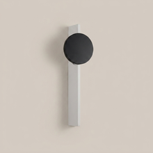 Dual-light battery wall light on a clean studio background