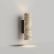 Travertine wall light on a clean studio background
