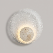 Langham travertine acrylic wall light on a clean studio background
