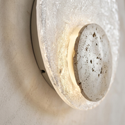 Close-up of travertine and acrylic texture on wall light