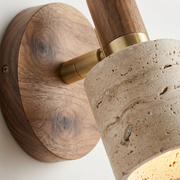 Close-up of walnut wood grain and travertine texture on reading wall light