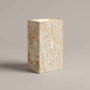 Travertine outdoor wall light on a clean studio background