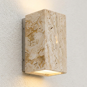 Close-up of natural travertine stone texture on outdoor wall light