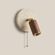 Primrose rotatable travertine wall light in Walnut finish on a clean background