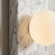 Close-up of marble veining and glass globe on a Holland wall light